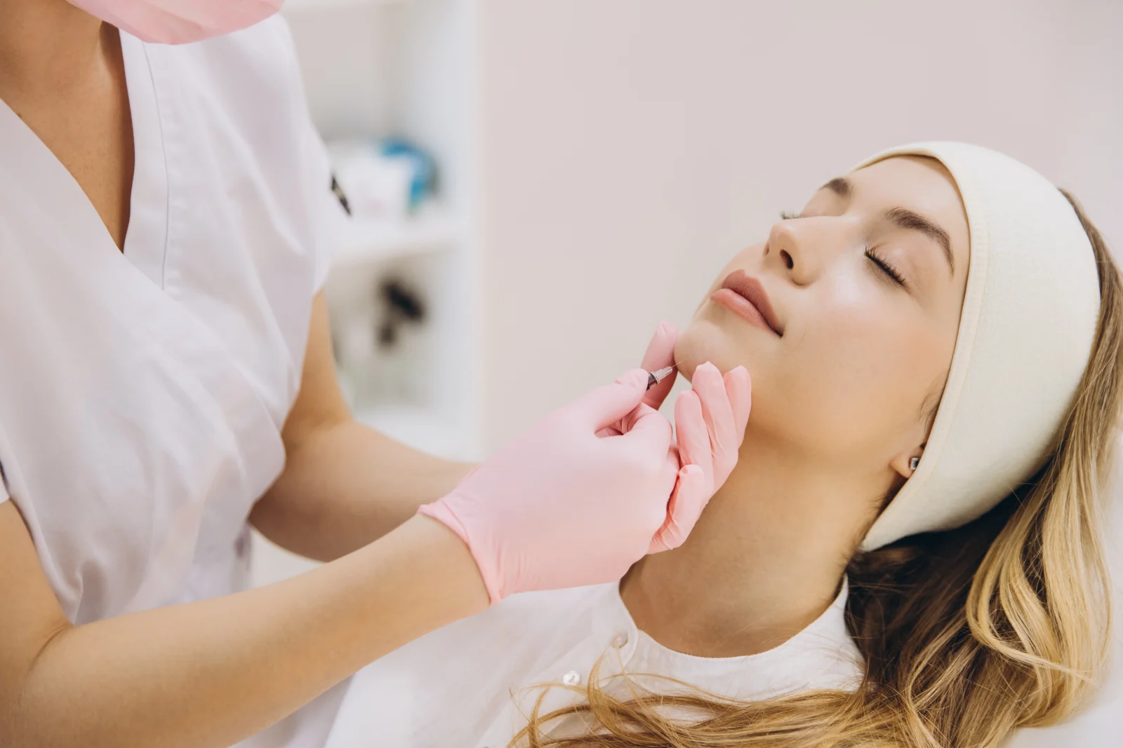 Injector placing dermal filler in a patient's chin